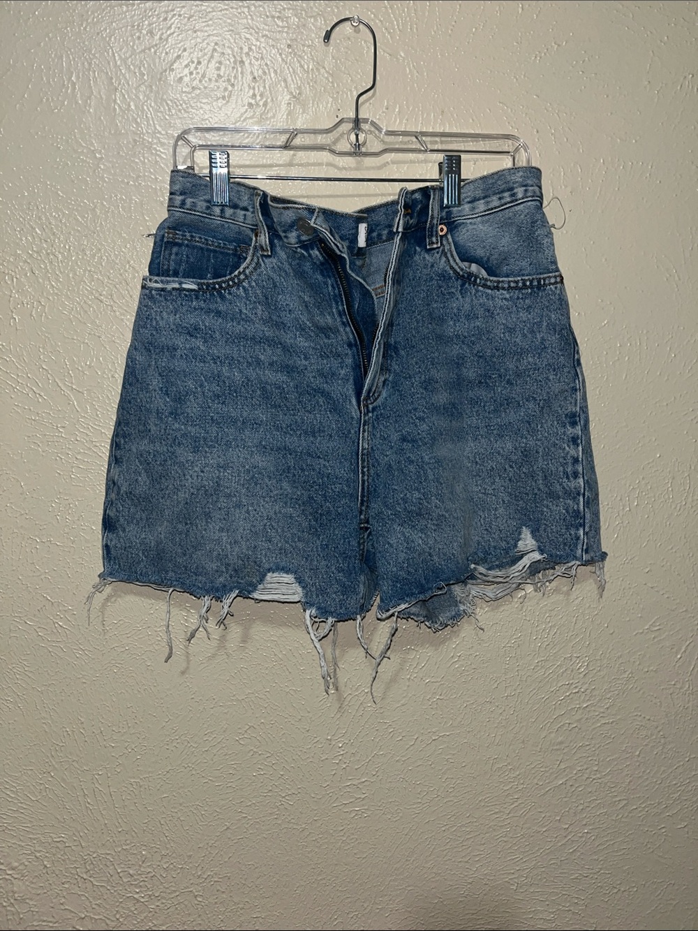 High-Rise Distressed Blue Denim Skirt